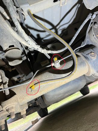 Noticed this hose hanging today. It runs from somewhere around the gas tank to a T connection mounted on rear axle. Metal lines connect to each side of T connection.
Looks like it has been broken for a while. 
Any ideas what it is?