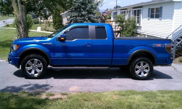 New  mods window vents and tint borla pro xs si/do with black Chrome tips and 305/50/20 general at2 grabbers