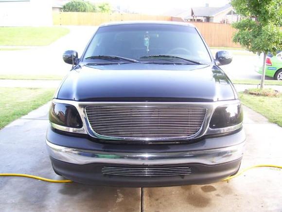 2002 F150 V8 4.6
2/4 lowering kit
Volant CAI
Diablo Sport Programmer
Billet upper/lower grill
Niteshade Heads and Tails
22in wheels/Yokohama tires
Flamed carbon fiber mirror covers
After market exhaust dumps after backseat
Carbon fiber trim kit front/back (Interior)
Sumas Media 7in flip screen
2 12in MTX subs under backseat