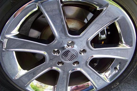 Front Wheel Before. Nice wheels, but they call it "detailing" for a reason. Note the black brake dust on the insdie of the wheel and the rusty / unpainted brake rotor hat. This kind of stuff drives me wild.