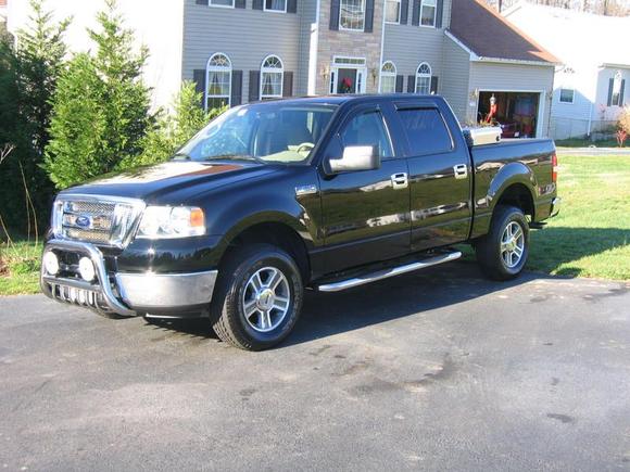 Chrome grill, stainless steps and handles, bull bar and fogs