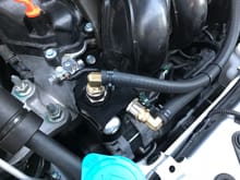 
Picture take to document clearance to the washer fluid reservoir.  Also the hoses are lightly zip tied together to give them more support.  