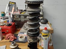 Here is my coilover as it was in the car, complete with factory cutout in the stack above...