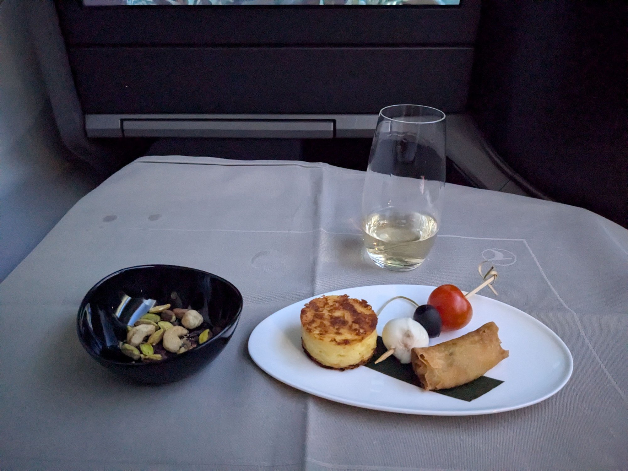 Warm nuts, champagne, canapes (hot items were both hot and crisp, cold were served nice and chilled)