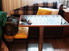 Here's your desk area, with AC and usb easily accessible. Couch more comfortable than it perhaps appears.
