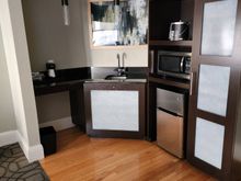 refrigerator, freezer, microwave, bar sink and coffee maker