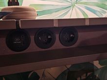 Power sockets under the desk.  Nice bits cut out for power cables