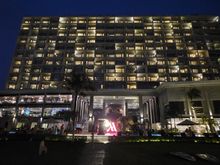 Night-time view of the hotel from the garden