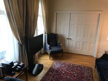 Slideable door closed between bedroom and living room
