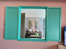 Window through bedroom into bathroom
