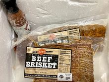 Two slabs of ribs, a pound of brisket, and a bottle of sauce all frozen cold. 