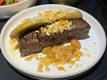 FLAT IRON STEAK with roasted endive.  The steak was done medium-medium well.  I sliced it thinly and it was pretty decent.

