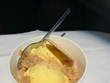 Choice of plated dessert (passion fruit cheesecake on my flight) or the ice cream with toppings and wafer biscuit (on my flight it was berries topping or toffee, while other flights appeared to have chocolate)
