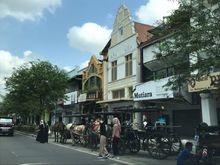 Street is filled both sides with shops