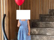 Kids being given a balloon at check-in