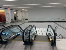 First set of escalators down to…