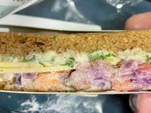 Euro Traveller: Vegan New York Deli sandwich (applewood smoked vegan cheese alternative and gherkin with rocket dressed with gherkin Dijon mustard mayonnaise and vegan slaw on farmers’ bread)