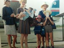 I'll admit it, I didn't take this picture. I'm the one hiding behind my boarding card. 
Aircraft is an AN-24W.