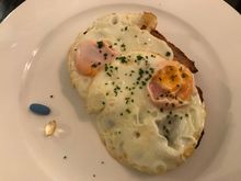 Two sunny side eggs on bread : the pils on the left are for my nerves :)