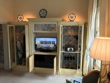 Storage space with safe, iron & board, slippers and shoeshine