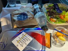 Main meal (same in both directions). A bottle of plain olive oil rather than salad dressing. 