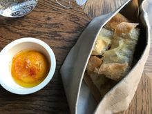 Complimentary warm bread with hummus dip