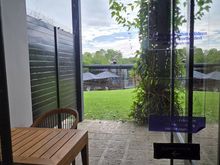 A view from our room towards a small balcony area and then to the pool. Not sure how nice it would be to stay at night here as there are a lot of insects if you leave the lights on