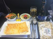 Touched down at LHR at 20:59. Wind was the issue as you all guessed correctly, on approach to FNC we held for 45 mins as gusts were at the top limit for landing, before diverting to FAO. Was expecting nothing more than a small filled roll for the return flight, was pleasantly surprised we received a full hot meal. Y pax received bread rolls and biscuits and nuts only. Hotels will be provided at BA's expense even though this was a weather related delay. Crew was excellent.  