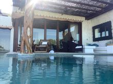 In the pool, looking to living room
