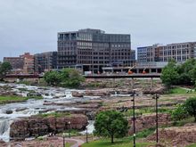 The Canopy by Hilton Sioux Falls Downtown (on the right) features a bar area that overlooks the waterfalls, although the view might not be as prominent from the side where you’ll spend most of your time. But it is just a short walk towards Falls Park.