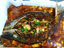 Extremely spicy fish dish at the local food court People's Park in Singapore 