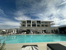 View from the pool on the second floor. Directly across is Lola Rose, with rooms upstairs on the third and fourth floor. Around other parts of the second floor, connected by outdoor walkways, are various other rooms and suites.