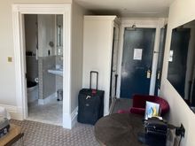 Looking at the bathroom and entrance with closet