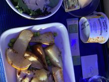 Grilled chicken with potato wedges in lemon sauce