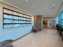 Walkway from entrance to the elevators with tarmac views on one side