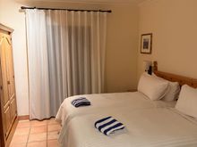 Second bedroom with two beds pushed together.
