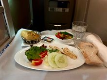 BA2230 BKK-LGW 1st meal starter: salad with tofu slices. Awful. Potato salad had a weird dressing (neither vinegary nor creamy), what I initially was excited about being halloumi turned out to be cold sliced tofu that tasted like cardboard. Served with a side salad, a slice of GF bread, and, very unhelpfully, a regular bread roll <facepalm>