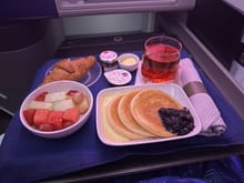 Breakfast of Blueberry Ricotta  w/ Cream with Fruit, Croissant, and 1/2 Cranberry + 1/2 Sparking Water