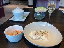 Poached eggs with sauerkraut and a glass of fizz.