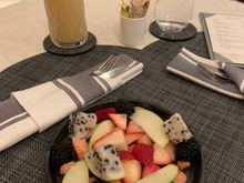 For breakfast: mixed fruit plate with a mango and pineapple smoothie