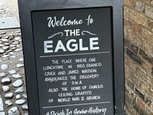 The Eagle Pub in Cambridge. It was a popular gathering place for first RAF and later USAAF Airmen. Many burned their names into the ceiling, and some even drew pictures. It was also a popular gathering place for Watson & Crick. 