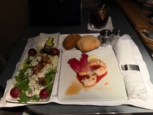 On this flight, The appropriate Centennial appetizers were served. The Waldorf Salad and Shrimp Cocktail were both excellent, even after asking the crew to delay my meal service 6+ hours. 