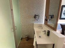 Sink area with shower and toilet in separate cubicles to the left of this picture 