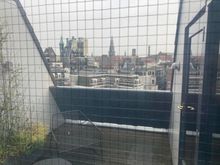 You can peep into the terrace : if you got nothing to hide : go agead but i bet this is done to keep watch and make sure things do not get out of hand ... it is Amsterdam and other hotels have had issues with visitors using  shrooms to get to the other side ....