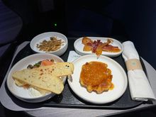 Coconut yogurt, maple bacon, waffle, and smoked salmon.

No welcome pastry … the crew fed themselves with it.

This was quite possibly the worst Mint cabin service I’ve ever seen on over 70 Mint flights.