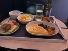 This was breakfast on an unexpected HEL-LHR flight I got rebooked onto after a delay caused us to miss the HEL-EDI flight. Luckily it was on their A350. However, since I was rebooked with only an hour's notice I of course did not get my special meal. It wasn't a big deals since the only meat was part of the cold cuts. The omelette was potato with a very buttery sauce.