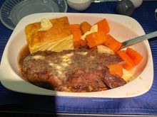 Got served the largest portion of meat I've ever had on a plane, ha, it was short rib and I slathered it in butter since it didn't really come with a sauce. Quite good and it absolutely stuffed me. It came with carrots and a potato au-gratin type thing that was good as well.