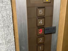A not at all salubrious tiny lift to floor 3