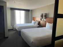 Queen Queen room (to my left was a desk, and to my right the standard HP couch)