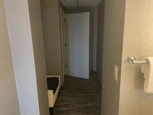 Odd hallway in bathroom. Connecting door to neighboring room. 